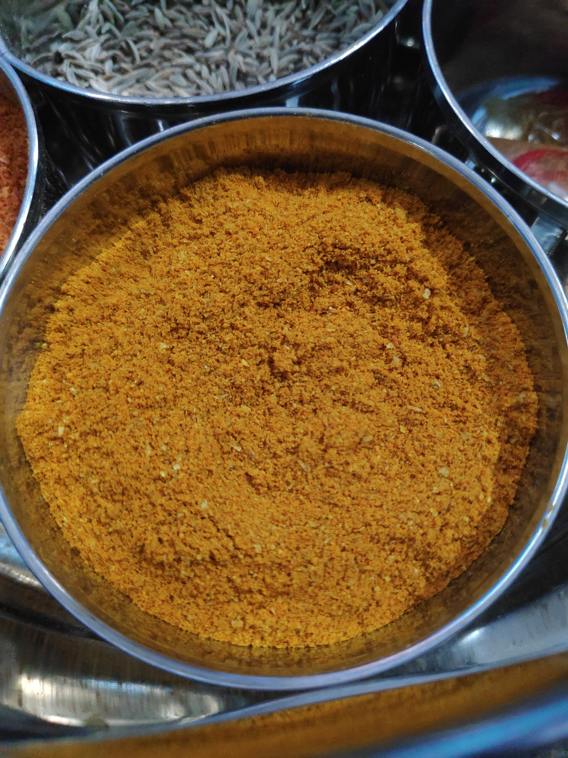 A colourful spice blend represents the vibrant flavours of Indian cinema and masala films.